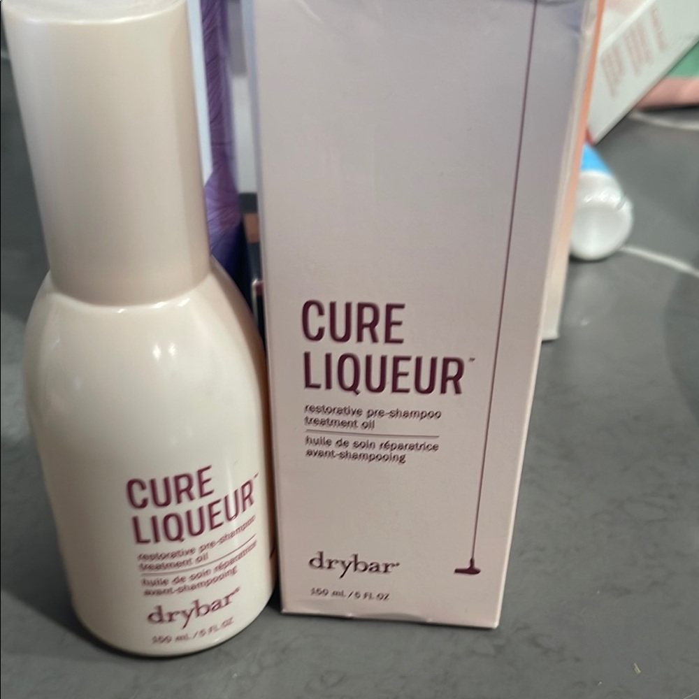 Drybar Cure Liqueur Pre-Shampoo Oil in Cream Packaging